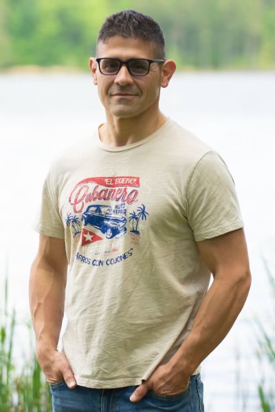 Portrait of Rafael Gomez, the owner of Gomez Moving & Assembly in Cary, North Carolina.